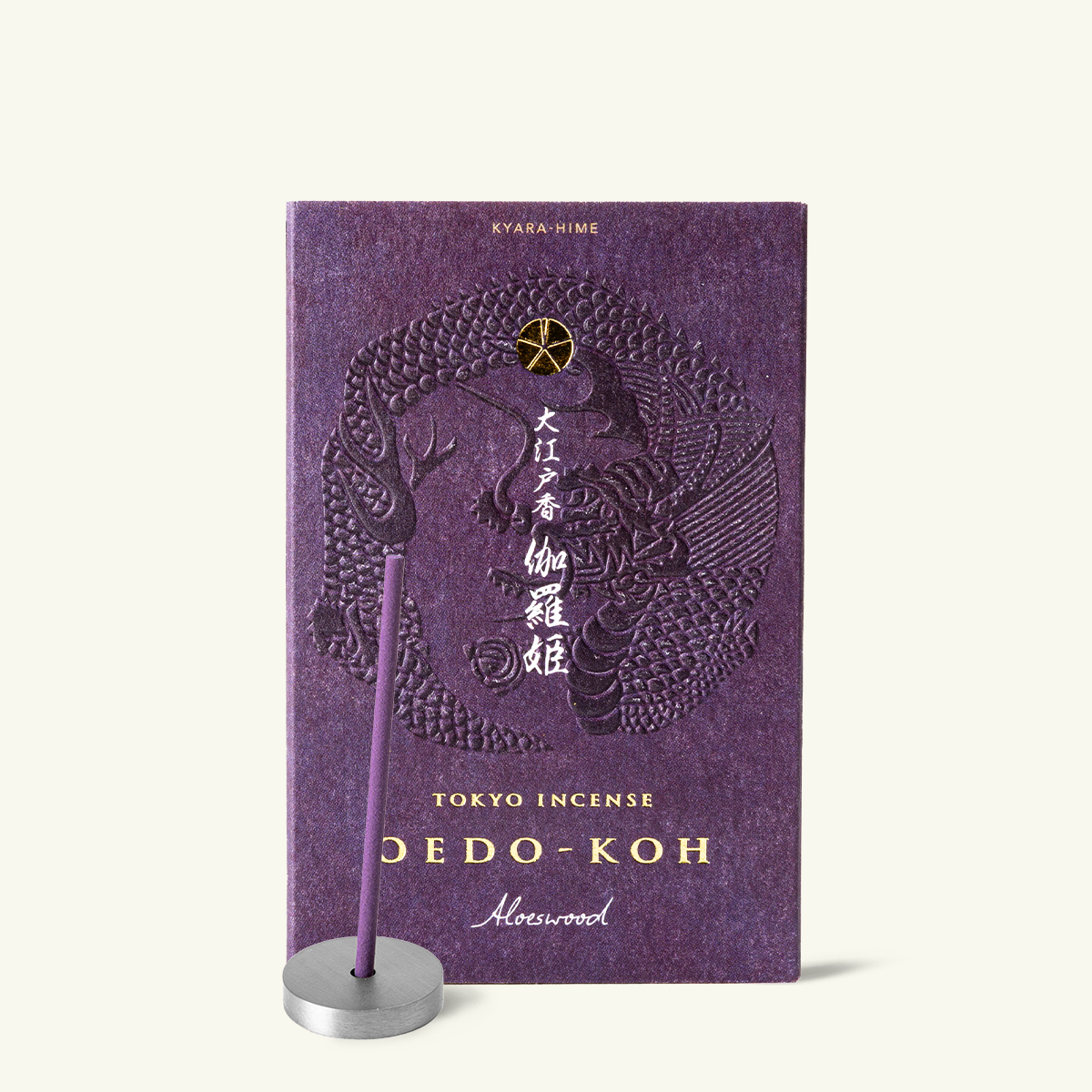 Purple incense box with dragon design and incense stick on a white background by Nippon Kodo, Oedo Koh collection
