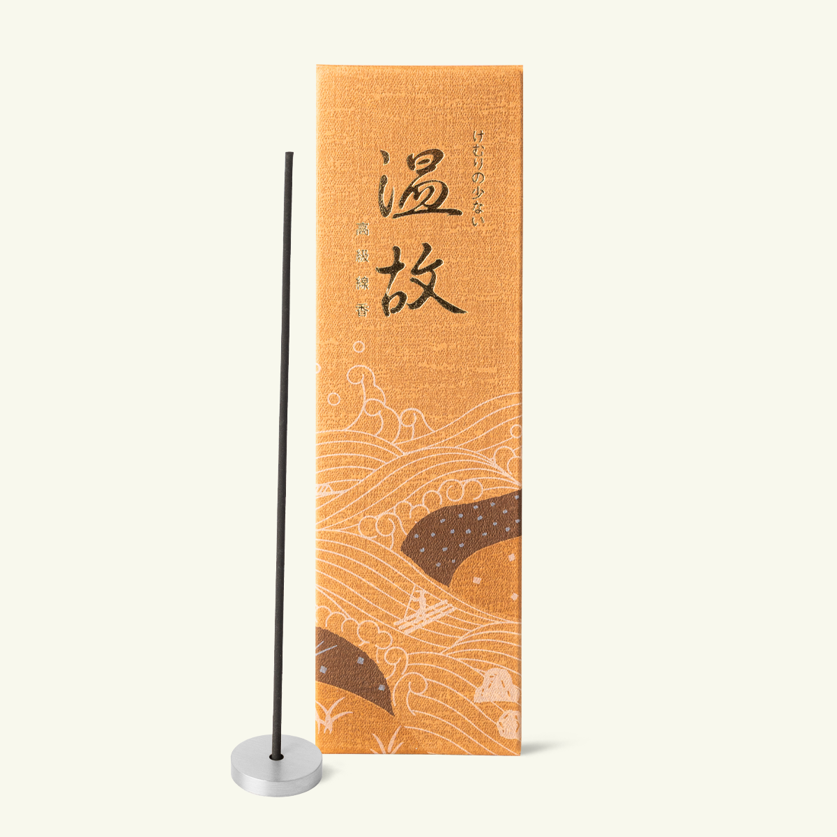 Gyokushodo Onko Japanese incense in an orange box beside a black incense stick in a silver holder