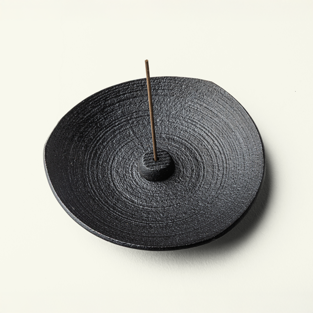 Side view of Japanese cast iron incense holder showing Sanpou tri-corner shape